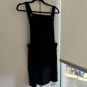 Black overalls style - in the shape of a dress.